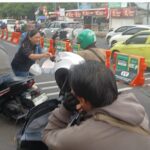 Subdit Indaksi Ditreskrimsus Polda Sulut Bagikan Ratusan Paket Makanan Gratis untuk Ojol di Manado